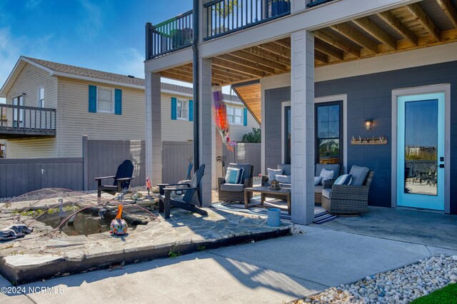 view of patio / terrace with an outdoor living space and a balcony