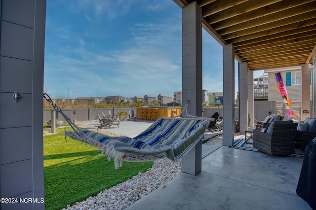 view of patio with a jacuzzi and outdoor lounge area