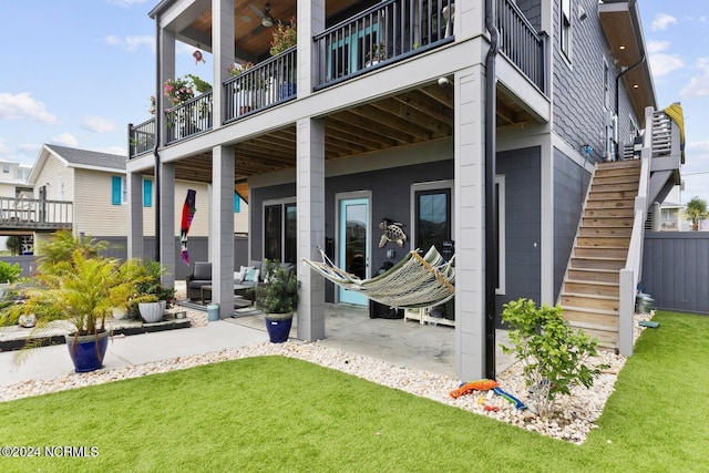 exterior space featuring a yard and a balcony