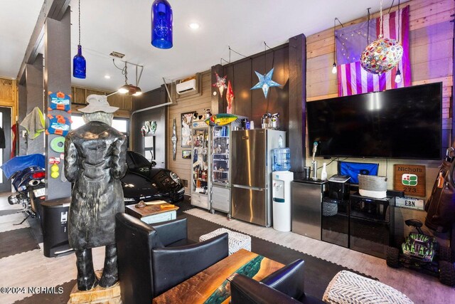 recreation room featuring wooden walls, a wall unit AC, parquet floors, and beam ceiling