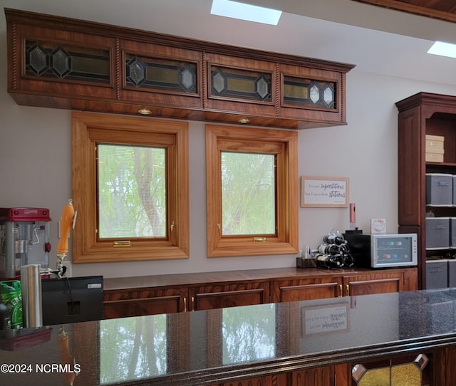 kitchen with a healthy amount of sunlight and a skylight