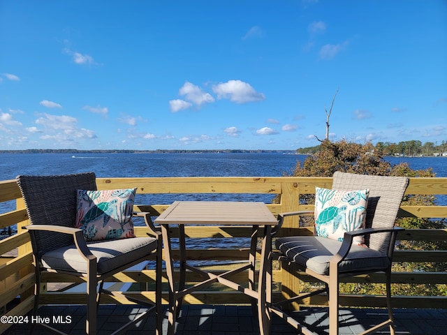 balcony featuring a water view