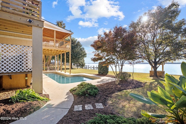 view of swimming pool with a water view