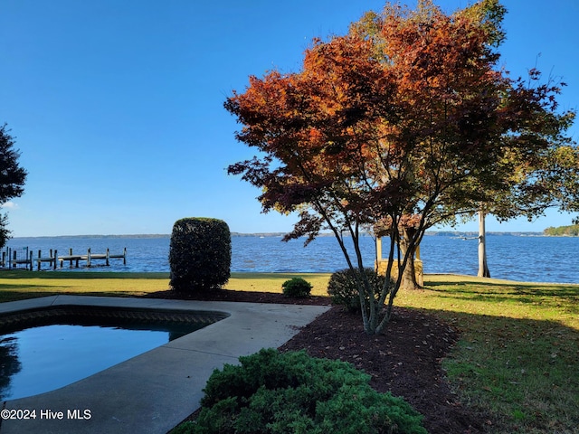 exterior space with a lawn and a water view