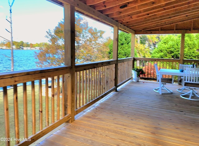 wooden deck featuring a water view