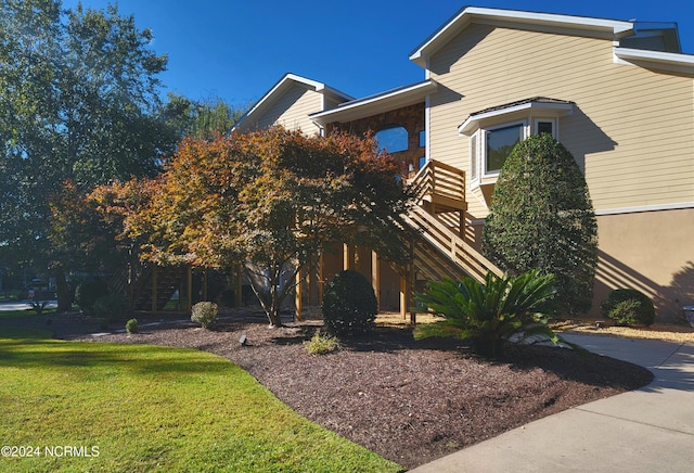 view of front of home with a front yard