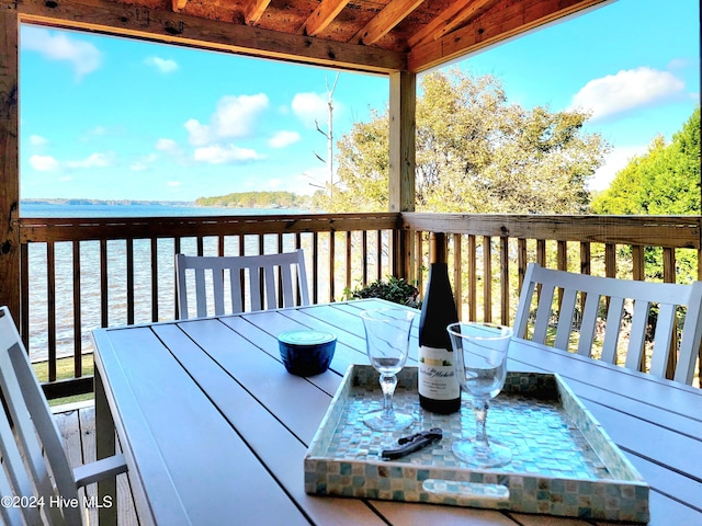 wooden deck featuring a water view