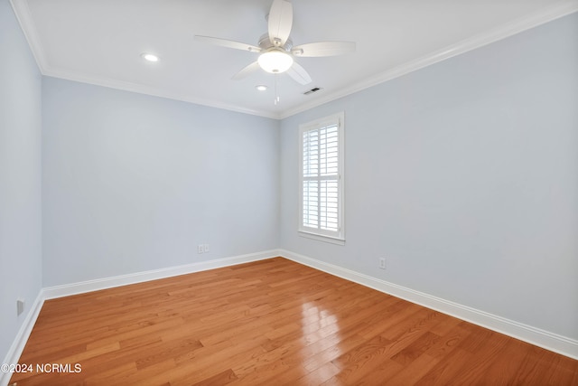 spare room with light hardwood / wood-style flooring, ceiling fan, and crown molding