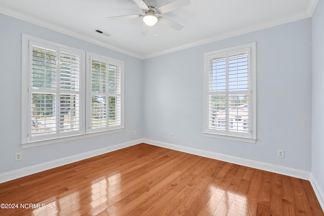 unfurnished room featuring ornamental molding, light hardwood / wood-style floors, and ceiling fan