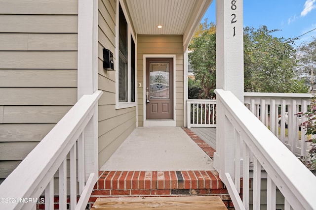 doorway to property with covered porch