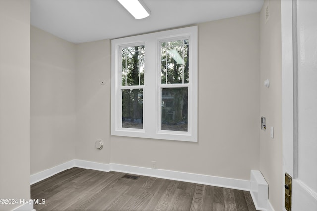 unfurnished room with hardwood / wood-style flooring