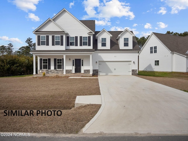 view of front of home featuring a front lawn and a porch