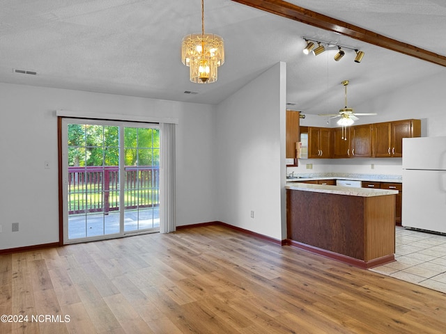 kitchen with white appliances, light hardwood / wood-style floors, lofted ceiling with beams, and kitchen peninsula