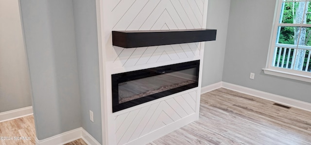 interior details featuring hardwood / wood-style flooring