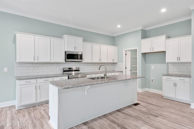 kitchen featuring light hardwood / wood-style floors, stainless steel appliances, sink, and white cabinets