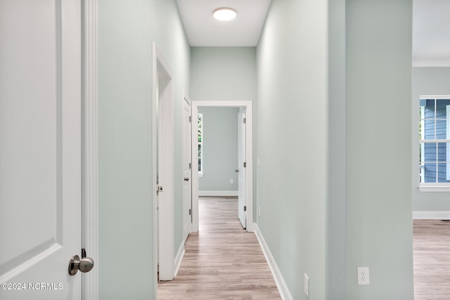 hallway with light wood-type flooring