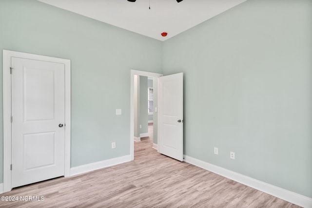 unfurnished bedroom with light wood-type flooring and ceiling fan