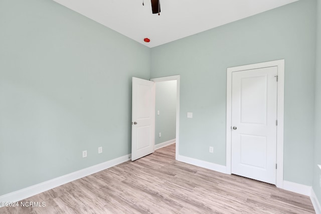 unfurnished bedroom featuring ceiling fan and light hardwood / wood-style flooring