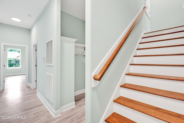 stairway with wood-type flooring