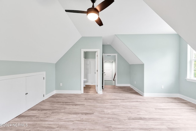 additional living space featuring light hardwood / wood-style floors, lofted ceiling, and ceiling fan