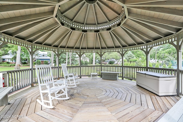 wooden terrace featuring a gazebo