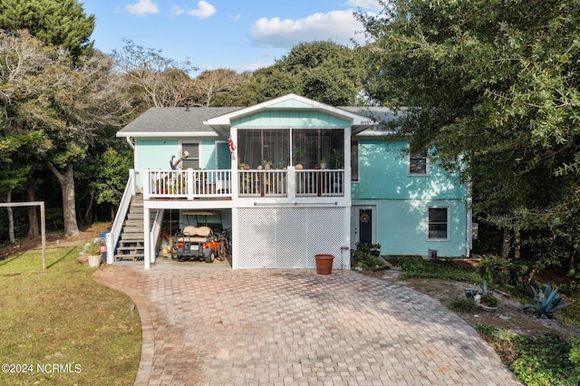 back of property featuring a sunroom