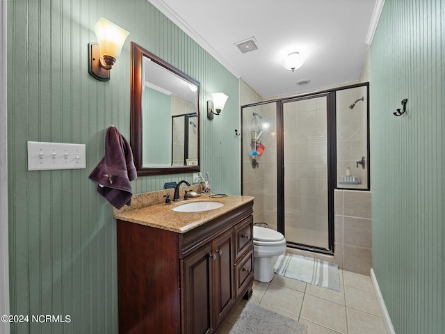 bathroom with toilet, crown molding, vanity, an enclosed shower, and tile patterned floors