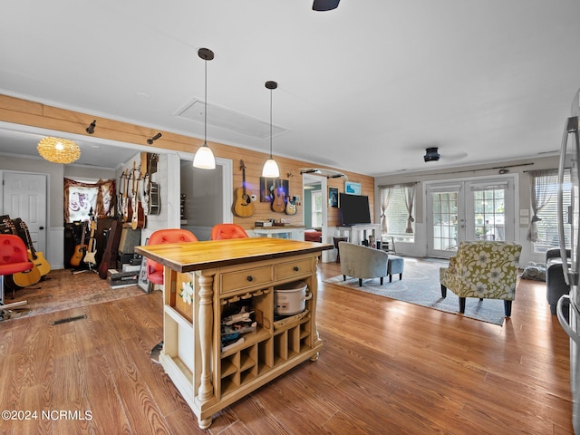 kitchen with pendant lighting and light wood-type flooring