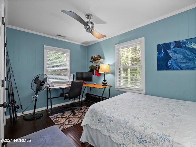 bedroom with dark wood-type flooring, ceiling fan, ornamental molding, and multiple windows