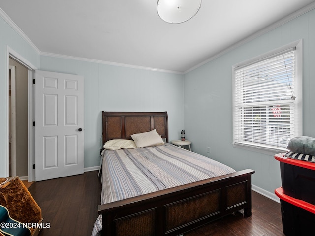 bedroom featuring ornamental molding and dark hardwood / wood-style floors