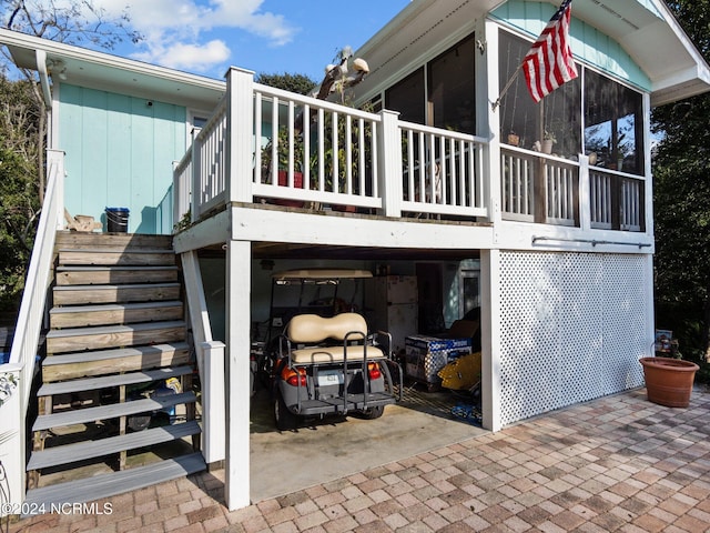 view of property exterior featuring a sunroom