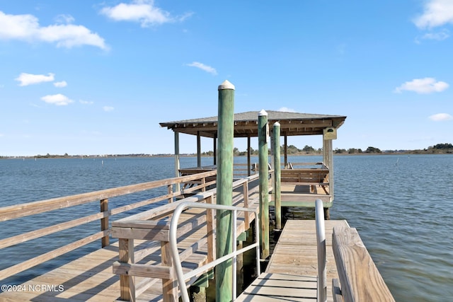 dock area with a water view