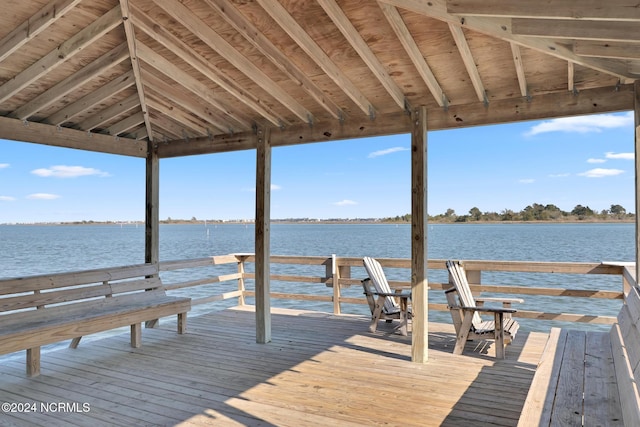 view of dock featuring a gazebo and a deck with water view