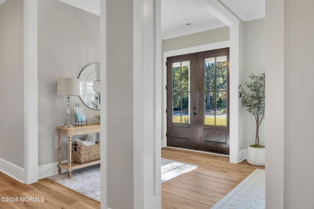 foyer featuring french doors and light hardwood / wood-style flooring