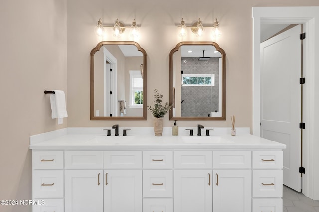 bathroom with vanity and a shower