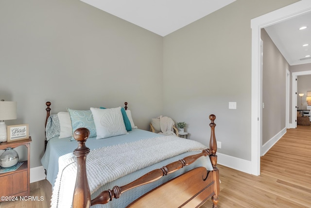 bedroom with light hardwood / wood-style flooring