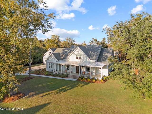 view of front of home featuring a front lawn and a porch