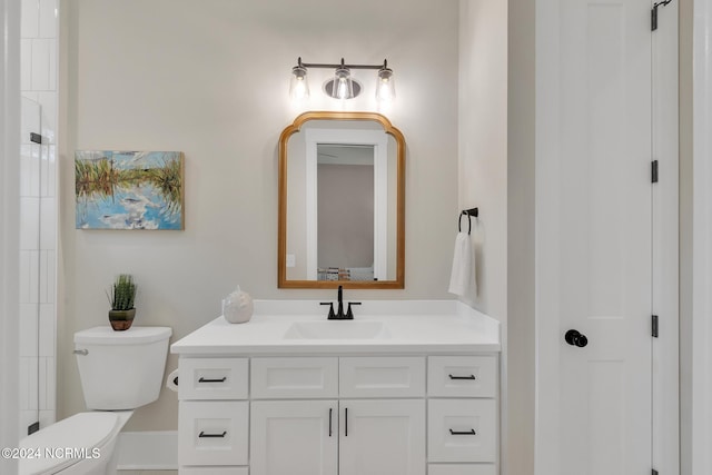 bathroom with vanity and toilet