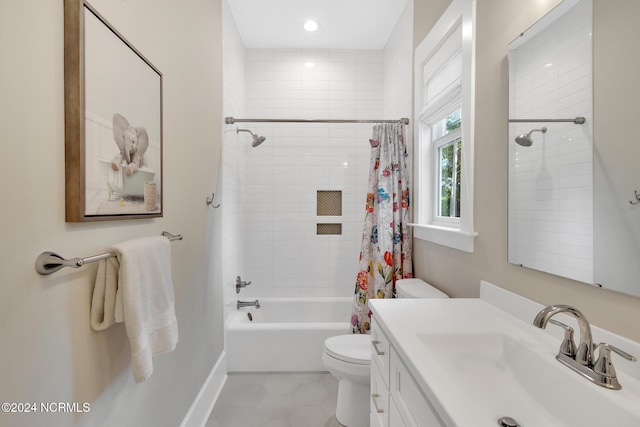 full bathroom with vanity, shower / bath combo, and toilet