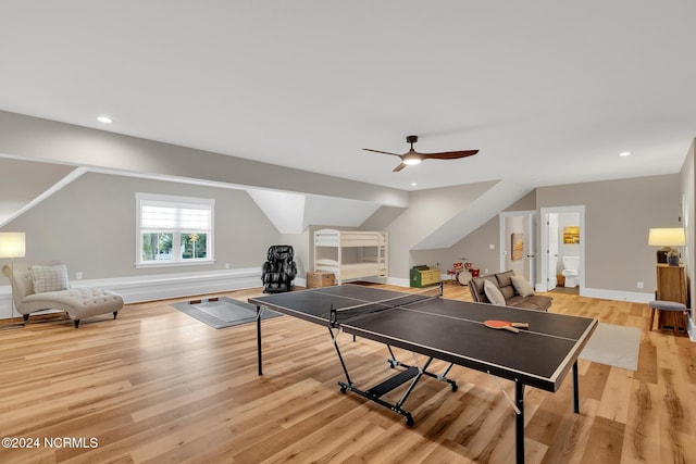 playroom featuring light hardwood / wood-style flooring, vaulted ceiling, and ceiling fan