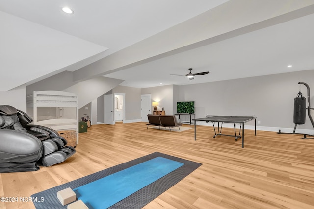 exercise area with wood-type flooring and ceiling fan