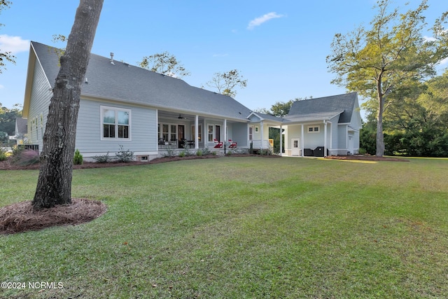 back of house with a yard and ceiling fan