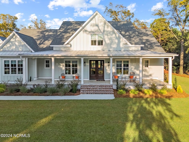 view of front facade with a front yard and a porch