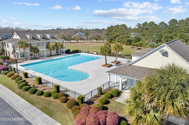 view of swimming pool with a patio area