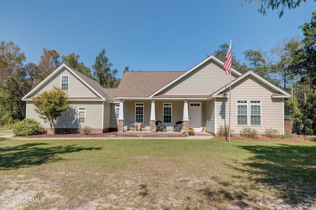 view of front of house featuring a front yard and a porch