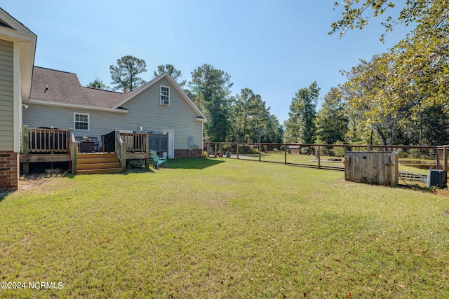 view of yard featuring a wooden deck