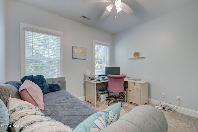 office space featuring light colored carpet and ceiling fan