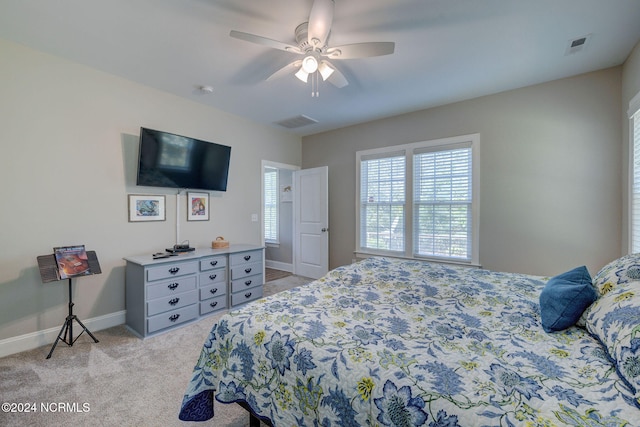 bedroom with light colored carpet and ceiling fan