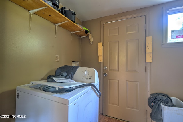 laundry room with wood-type flooring