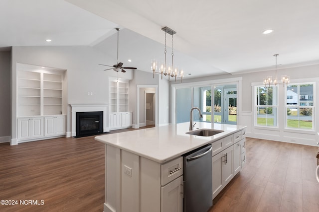 kitchen featuring sink, dark hardwood / wood-style flooring, stainless steel dishwasher, white cabinets, and a center island with sink